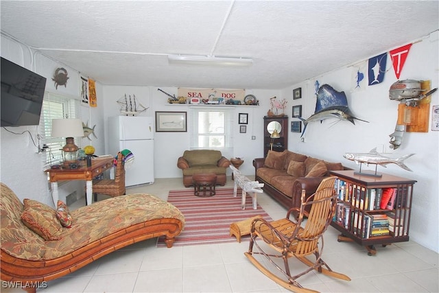 living room featuring a textured ceiling and tile patterned floors