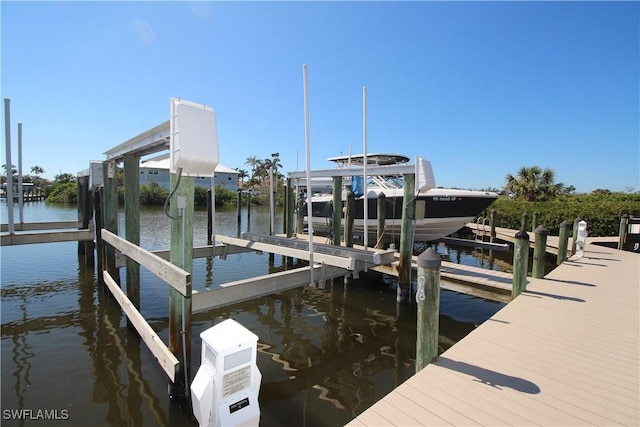 dock area featuring a water view and boat lift