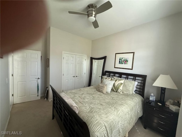 carpeted bedroom with a closet, a ceiling fan, and baseboards