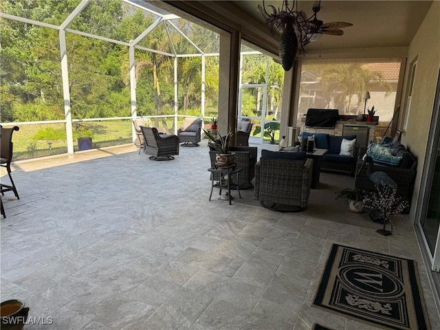 view of patio with glass enclosure, an outdoor living space, and a ceiling fan