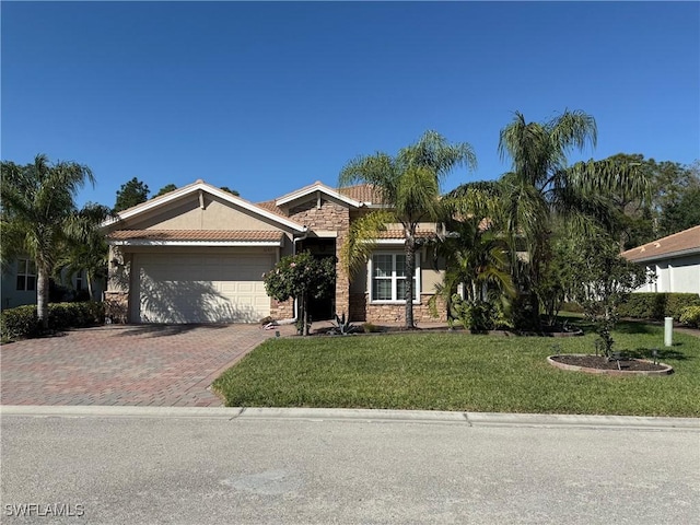 view of front of home featuring stucco siding, a front lawn, decorative driveway, stone siding, and a garage