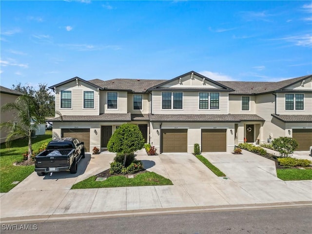 14127 Oviedo Pl, Fort Myers, FL 33905 - townhome / multi-family property featuring an attached garage and concrete driveway