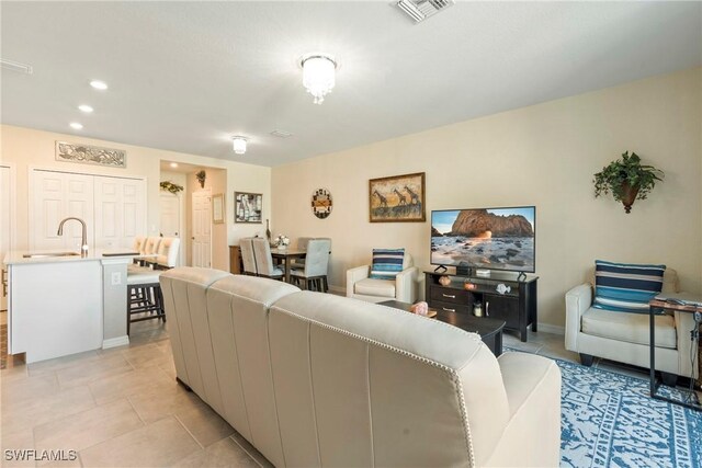 14127 Oviedo Pl, Fort Myers, FL 33905 - living area featuring baseboards, light tile patterned flooring, visible vents, and recessed lighting