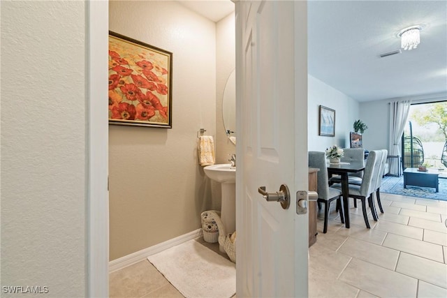 14127 Oviedo Pl, Fort Myers, FL 33905 - bathroom featuring a sink, tile patterned flooring, visible vents, and baseboards