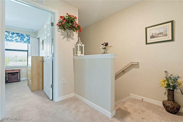14127 Oviedo Pl, Fort Myers, FL 33905 - hall featuring light carpet, baseboards, and an upstairs landing