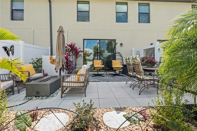 14127 Oviedo Pl, Fort Myers, FL 33905 - view of patio with fence and an outdoor living space with a fire pit