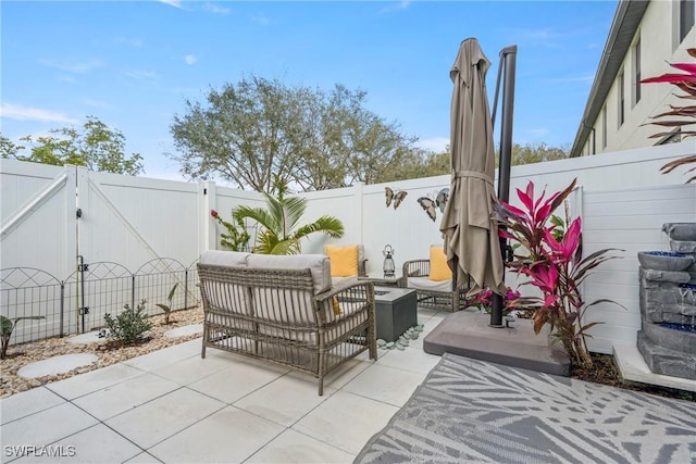 14127 Oviedo Pl, Fort Myers, FL 33905 - view of patio with a fenced backyard, a gate, and an outdoor hangout area
