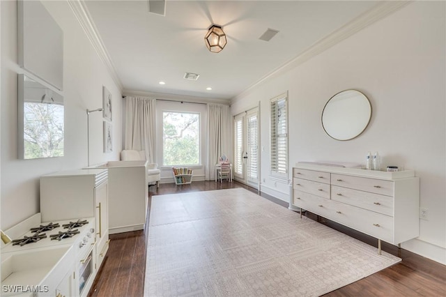 interior space featuring crown molding, recessed lighting, visible vents, and dark wood finished floors