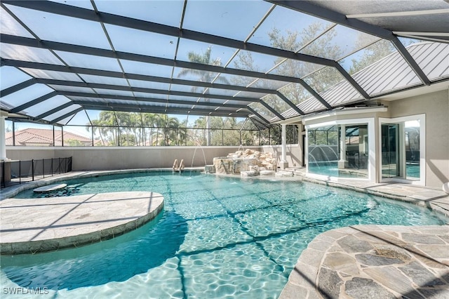 outdoor pool with a patio area and a lanai