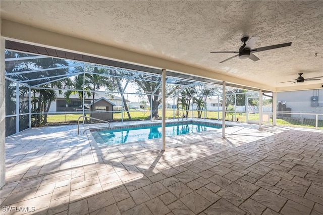 pool featuring ceiling fan, a patio area, and a lanai