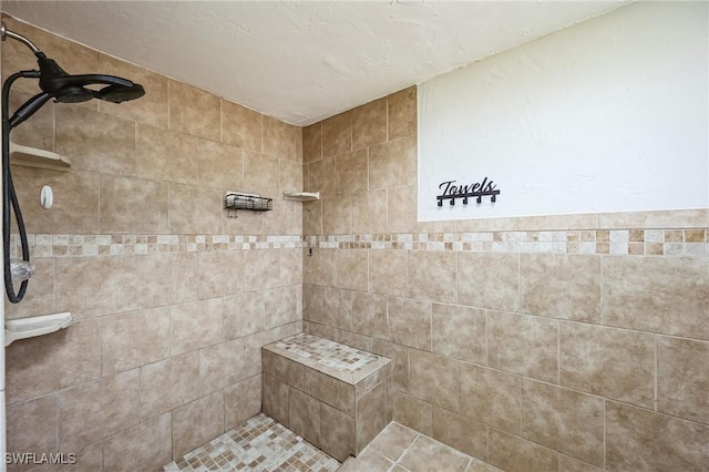 full bathroom with a tile shower