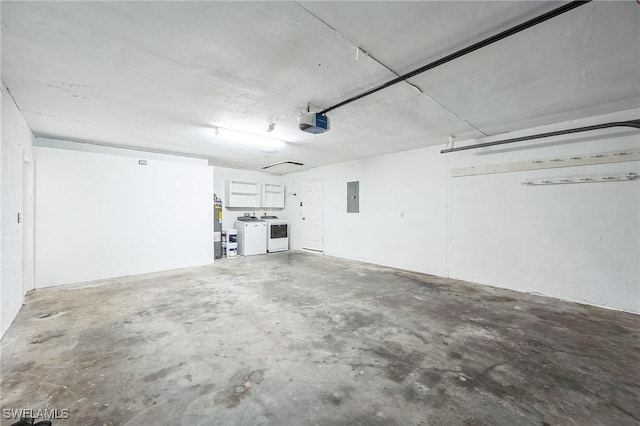 garage with electric panel, separate washer and dryer, and a garage door opener