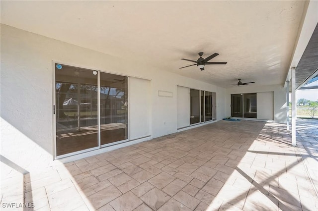 view of patio featuring ceiling fan