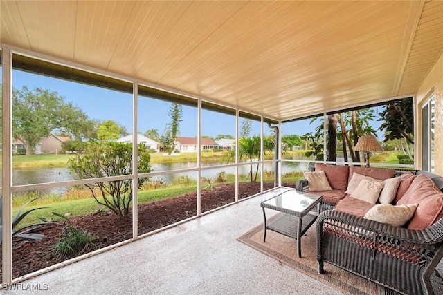 sunroom featuring a water view and wooden ceiling