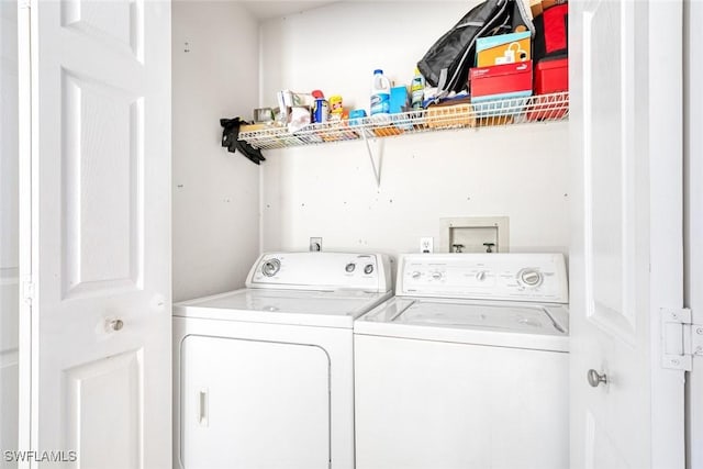 washroom with laundry area and washing machine and dryer