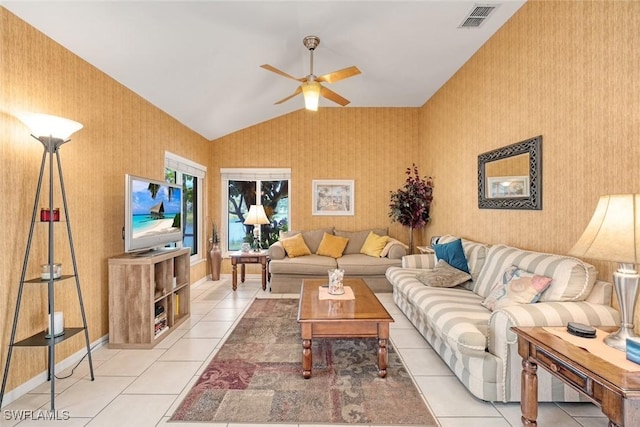 living area with lofted ceiling, light tile patterned flooring, visible vents, baseboards, and wallpapered walls