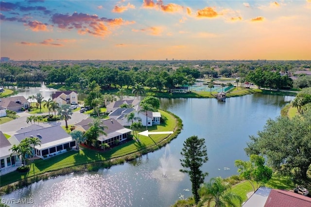 drone / aerial view featuring a water view and a residential view