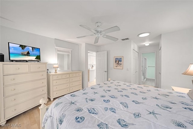 bedroom with visible vents, a ceiling fan, connected bathroom, light wood-style floors, and a closet