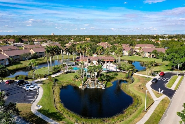 drone / aerial view with a residential view and a water view