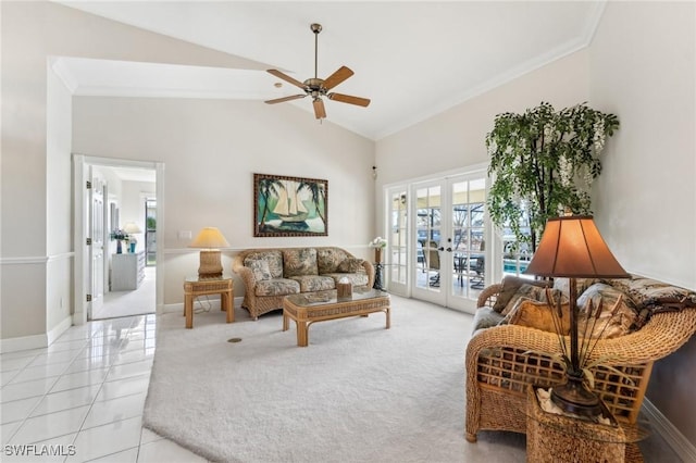 living room with light tile patterned floors, baseboards, crown molding, and french doors