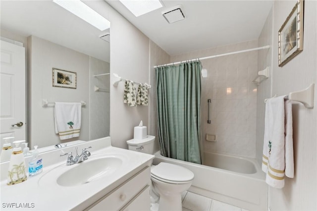 full bath featuring vanity, tile patterned flooring, shower / bath combo with shower curtain, and toilet