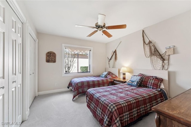 bedroom featuring ceiling fan, carpet, and baseboards