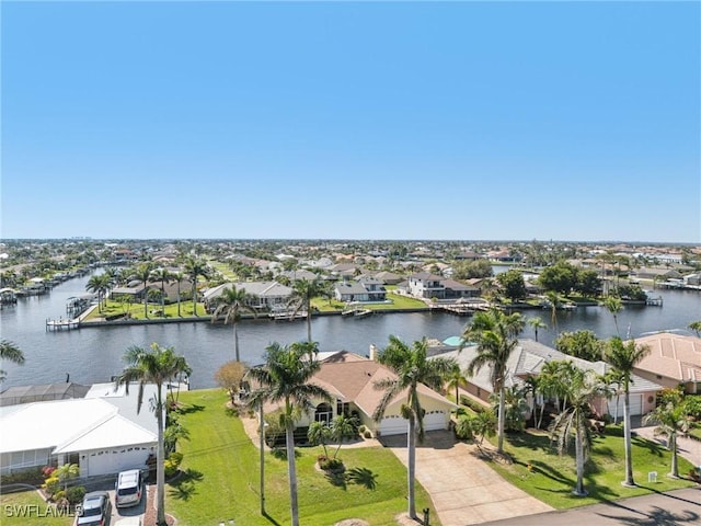 bird's eye view featuring a water view and a residential view