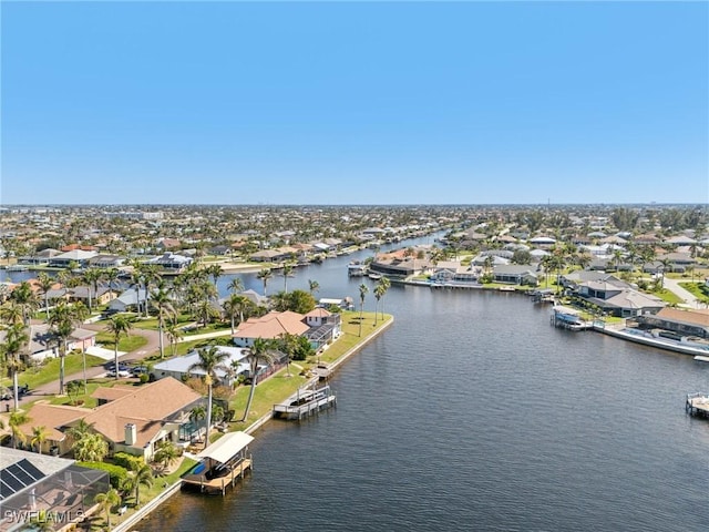 aerial view featuring a water view and a residential view