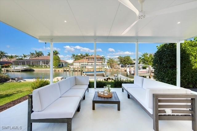 view of patio with a water view and an outdoor hangout area