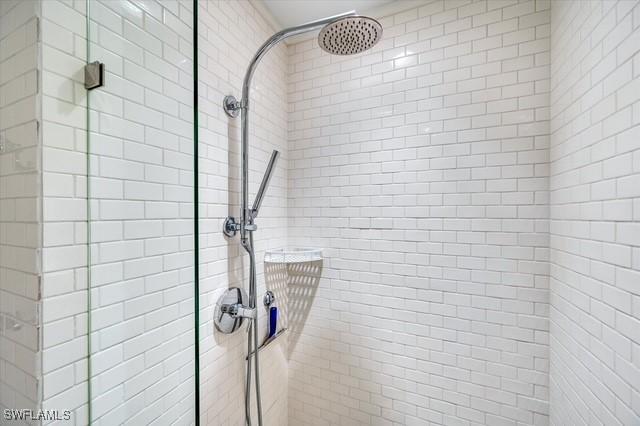 full bath with a shower stall