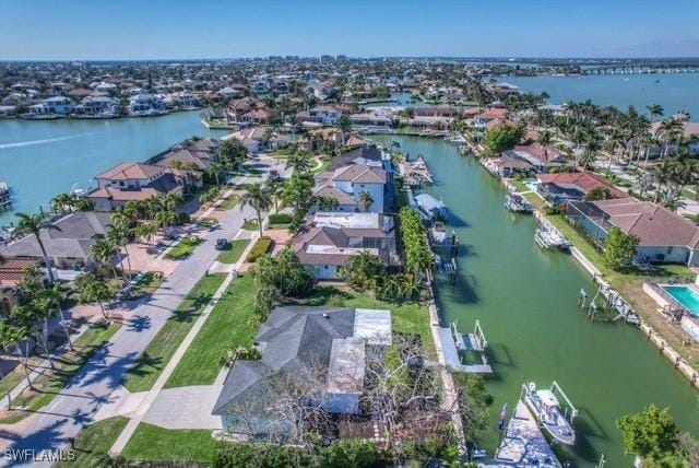 aerial view with a water view and a residential view