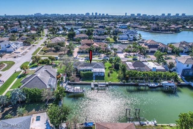 bird's eye view featuring a water view and a residential view