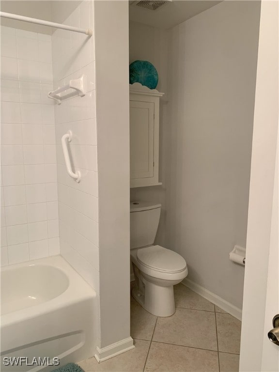 bathroom with a shower, tile patterned flooring, toilet, and baseboards