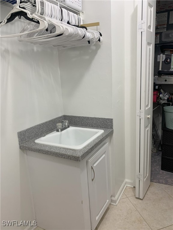 interior space with a sink and light tile patterned floors