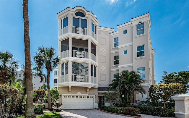14328 Harbour Landings Dr Unit 18C, Fort Myers, FL 33908 - view of property featuring an attached garage and driveway