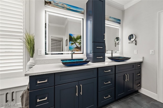 full bath featuring double vanity, tile patterned flooring, ornamental molding, and a sink