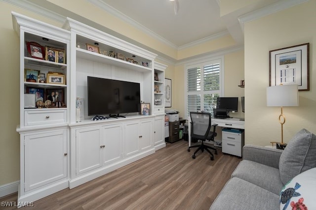 office area with light wood-type flooring and ornamental molding