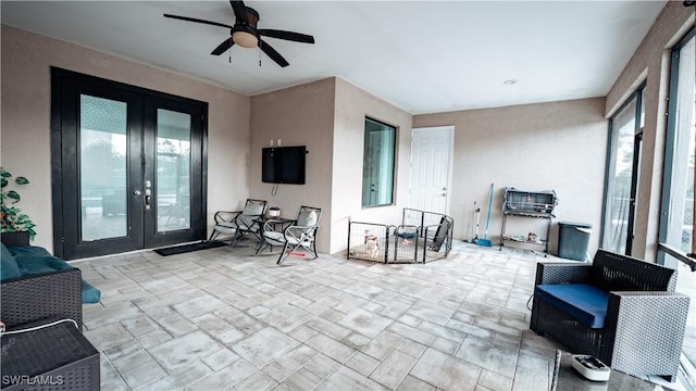 view of patio / terrace featuring french doors and ceiling fan