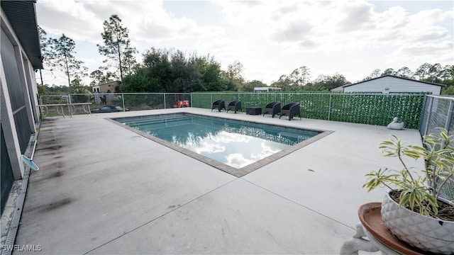 view of pool featuring a patio, fence, and a fenced in pool