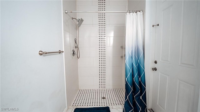 full bath with a tile shower