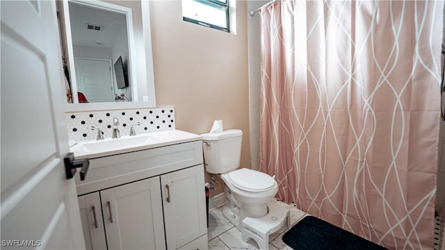 bathroom with marble finish floor, curtained shower, decorative backsplash, toilet, and vanity