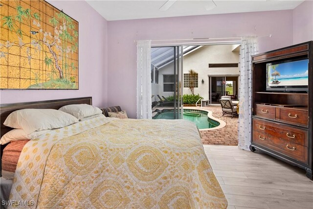 bedroom featuring ceiling fan, access to outside, and wood finished floors