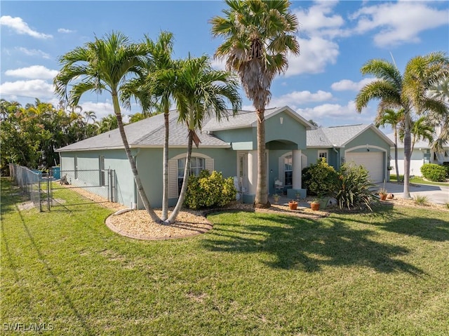 ranch-style house with a garage, a front yard, fence, and stucco siding