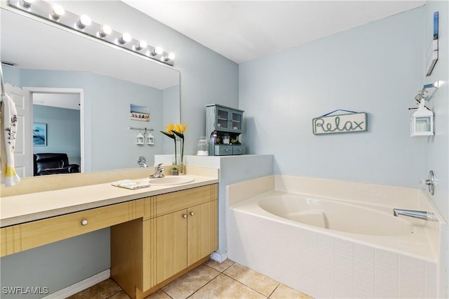 bathroom with tile patterned flooring, a garden tub, connected bathroom, and vanity