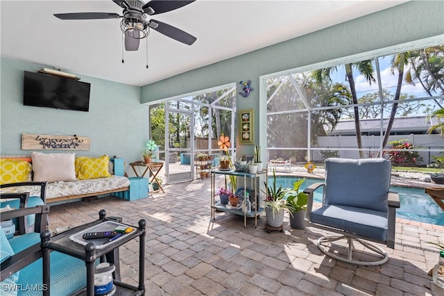 sunroom / solarium with ceiling fan