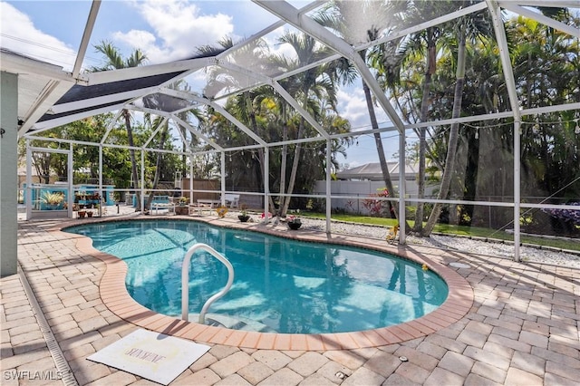 view of pool featuring a lanai, a fenced backyard, a fenced in pool, and a patio