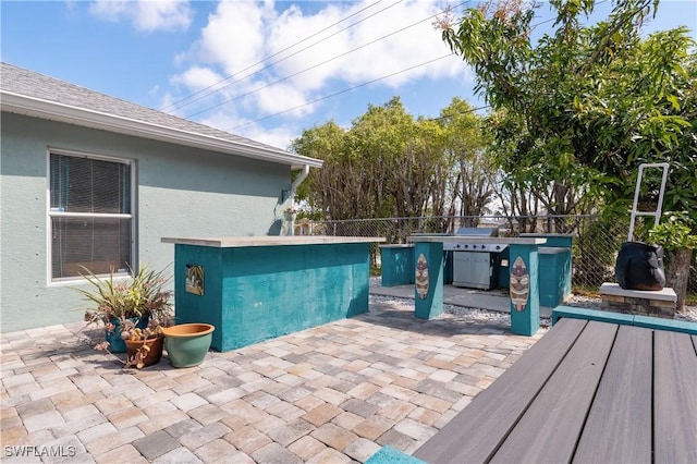 view of swimming pool featuring a patio area and fence