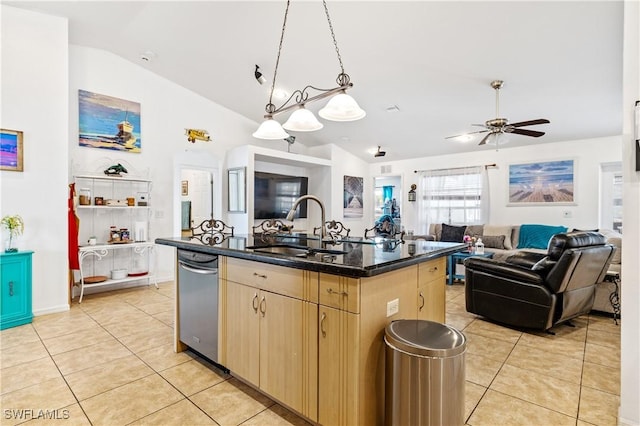 kitchen featuring open floor plan, light tile patterned flooring, a sink, and light brown cabinetry