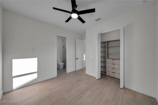 unfurnished bedroom featuring light wood finished floors, baseboards, visible vents, and connected bathroom