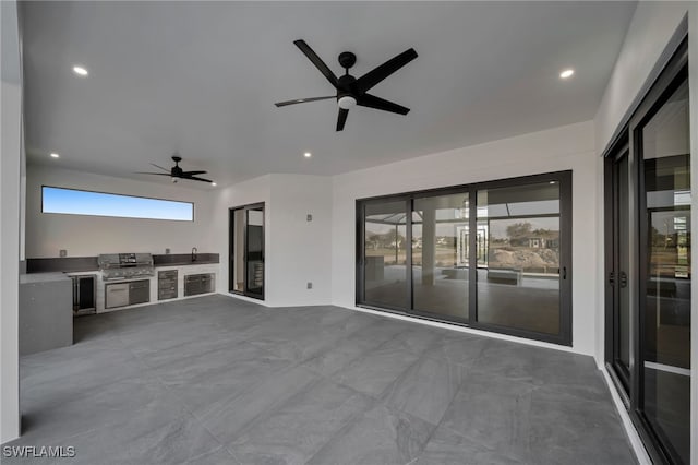 view of patio / terrace with ceiling fan, grilling area, a sink, and area for grilling